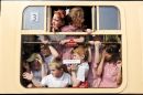 Schoolchildren spot the Olympic Flame at Bewdley train station during the London 2012 Olympic Torch Relay