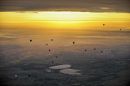 Hot air balloons, which lifted off from the main runway at Bristol International Airport for the first time in the airport's history, fly over the South West bathed in the glorious morning sun