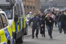A mob attempts to attack the police van containing Christopher Halliwell as it leaves Swindon Mags court with a heavy police prescence
