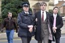 Pete Doherty is led out of Gloucester Crown Court  by police and marched towards Gloucester police station on the opposite side of the road