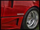 Red Ferrari rear wheel with Pininfarina badge