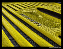 Yellow Ferrari rear grille in the rain